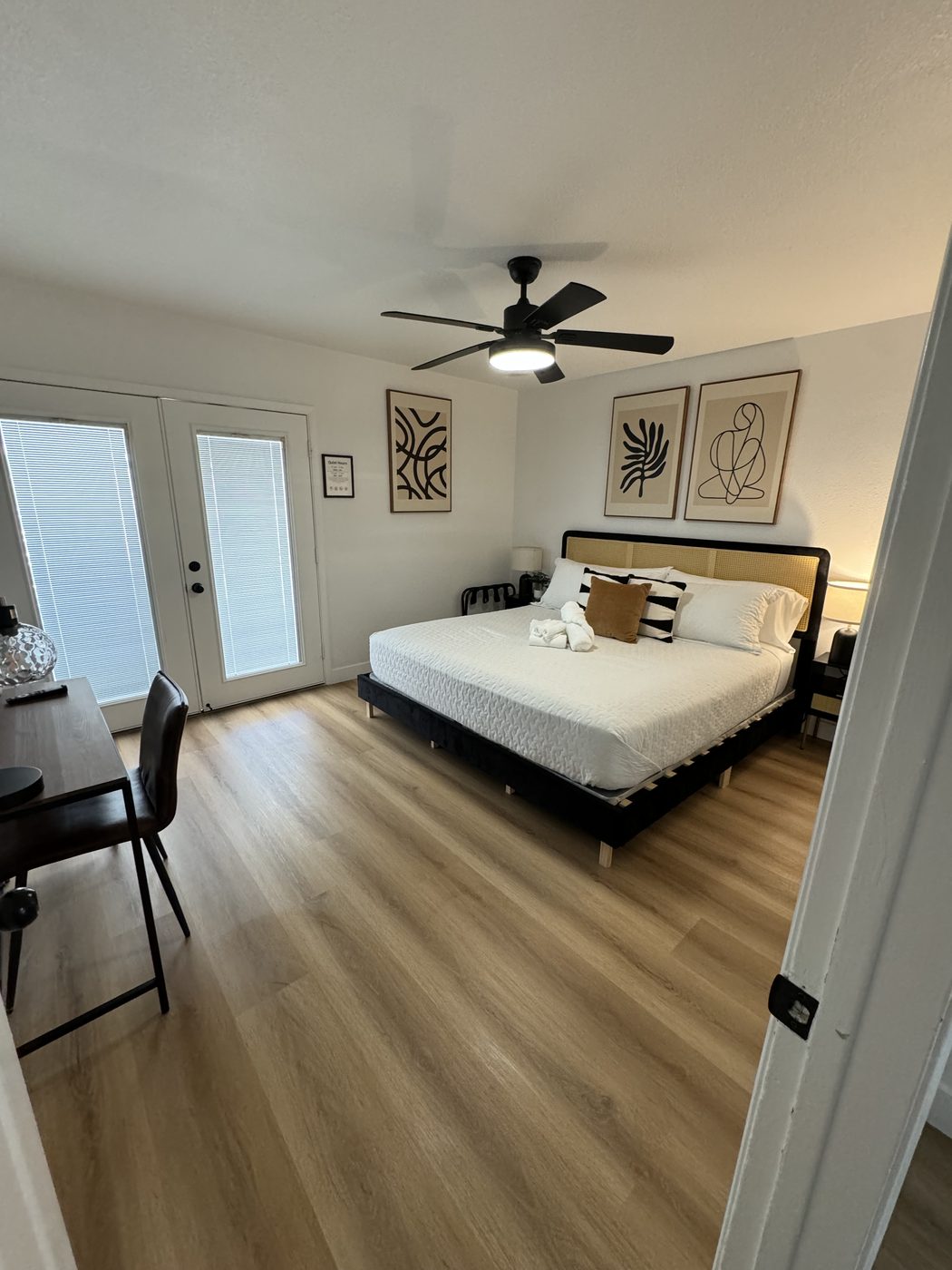 Bedroom with fresh linens and clean hardwood floors