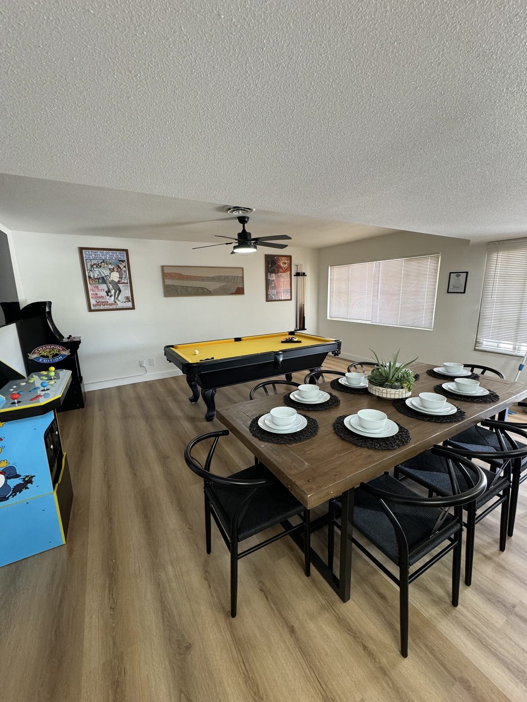 Dining room with table set and open floor space after cleaning