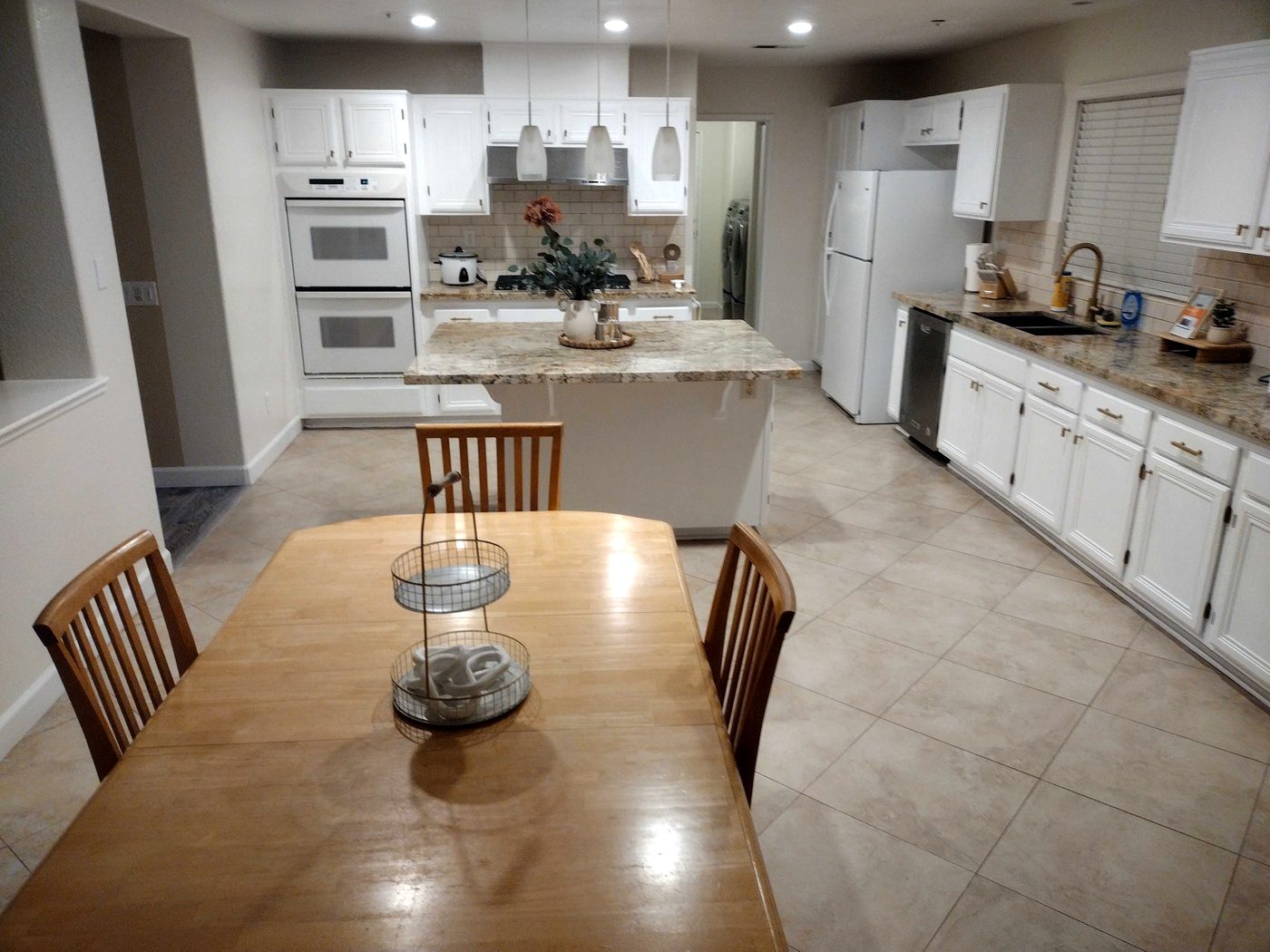Family kitchen with island and dining table after cleaning