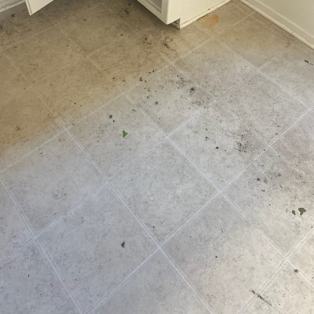 Kitchen floor before and after a move-out clean — before